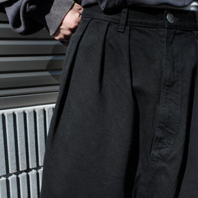 INTODUSK / SKEWED DENIM PANTS SOLID BLACK