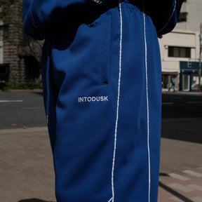 INTODUSK / TRACK PANTS SODALITE BLUE