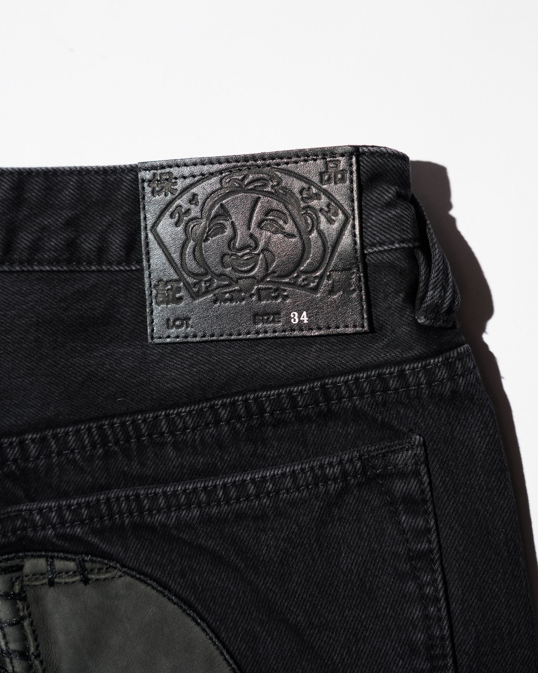 EVISU / LEATHER PATCHWORK DAICOCK DENIM JEANS - ZIP UP-LOOSE FIT MID TONE BLACK DENIM