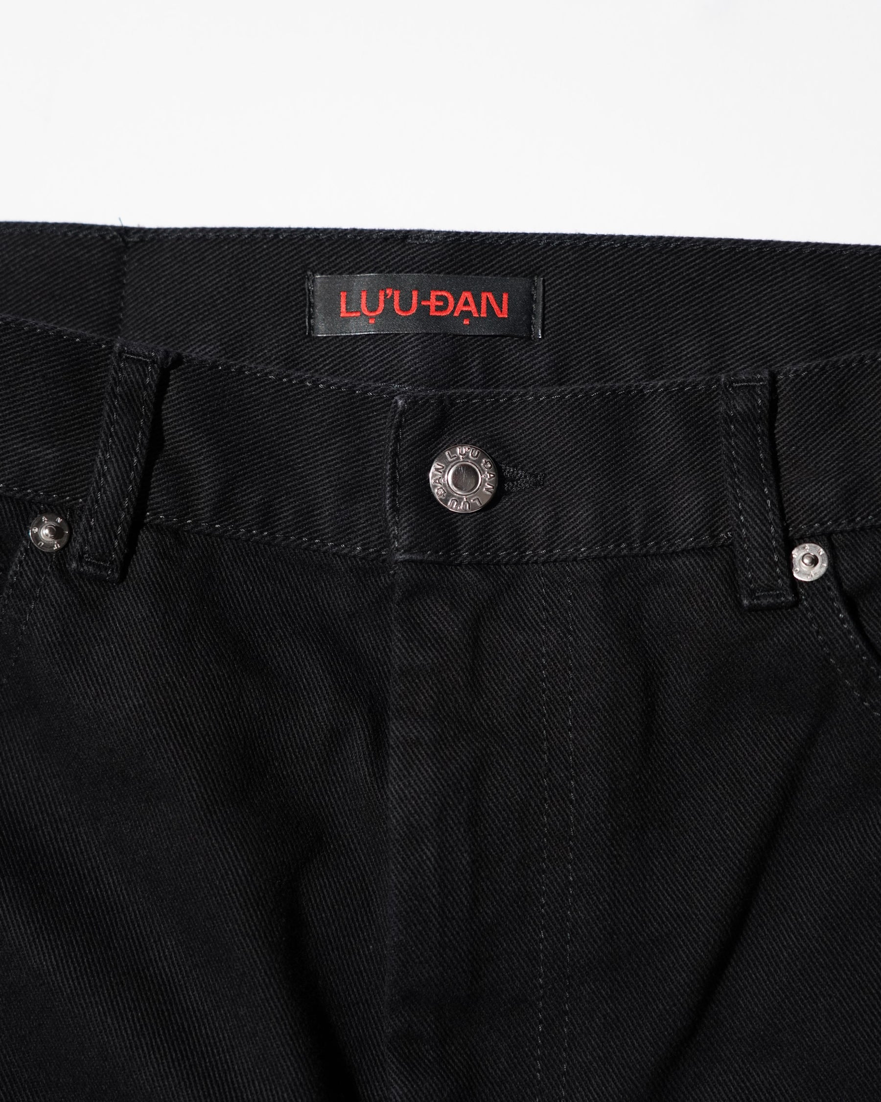 LU'U DAN / SIDE ZIP JEANS BLACK RINSE
