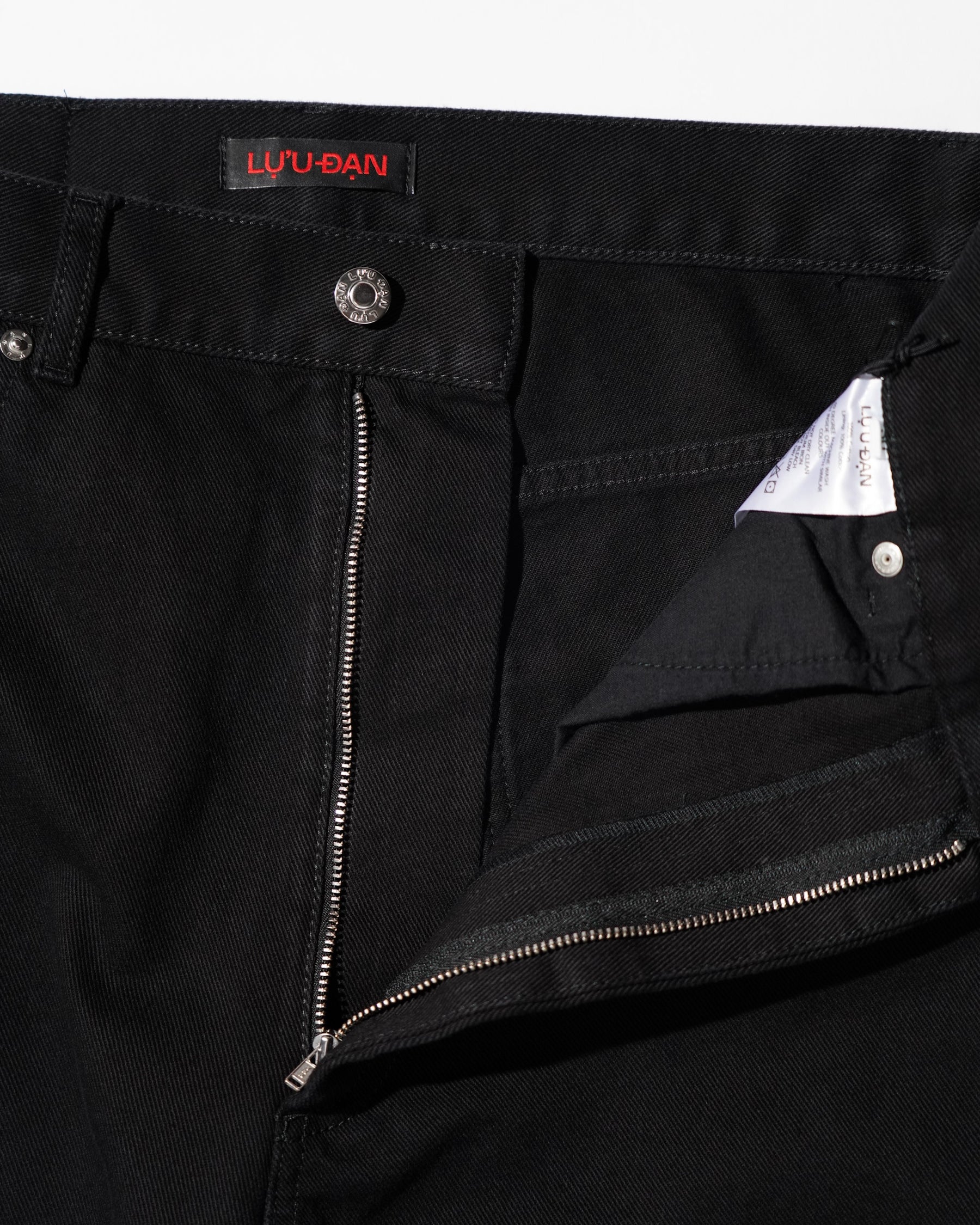 LU'U DAN / SIDE ZIP JEANS BLACK RINSE