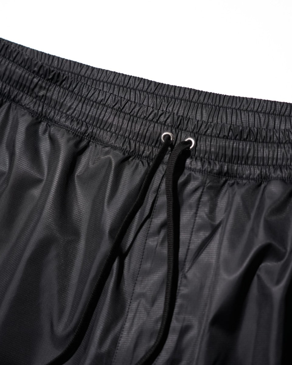 <span style="color: #f50b0b;">Last One</span> TSTS / RECYCLED POLYESTER WIND PANTS BLACK